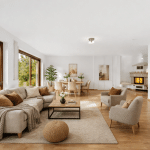 Wohnbereich mit Sofa und Dekoration nach professionellem Home Staging