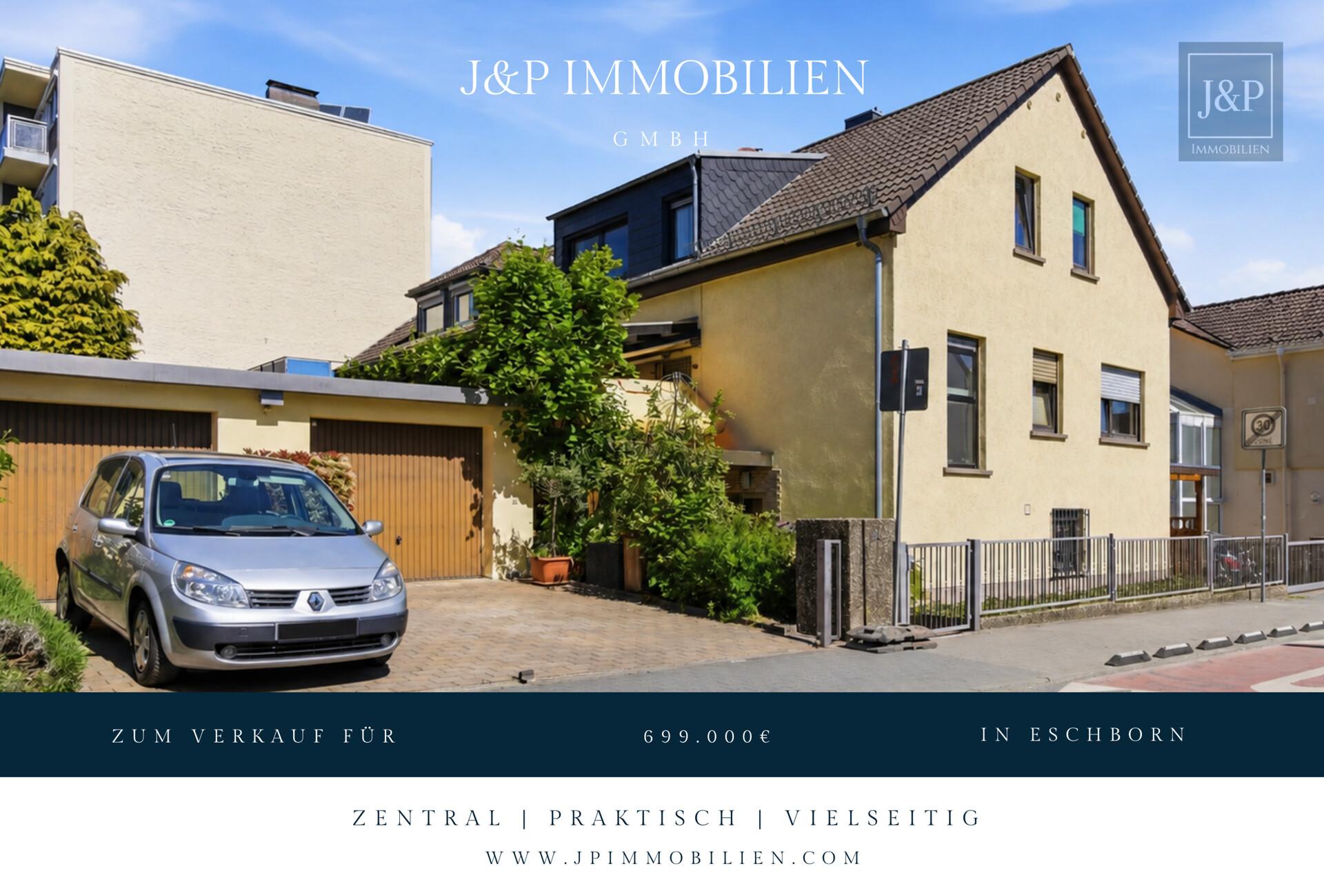 Zweifamilienhaus inkl. ausgebaute Parterre in zentraler Lage von Eschborn mit Terrasse & 2 Garagen - Titelbild