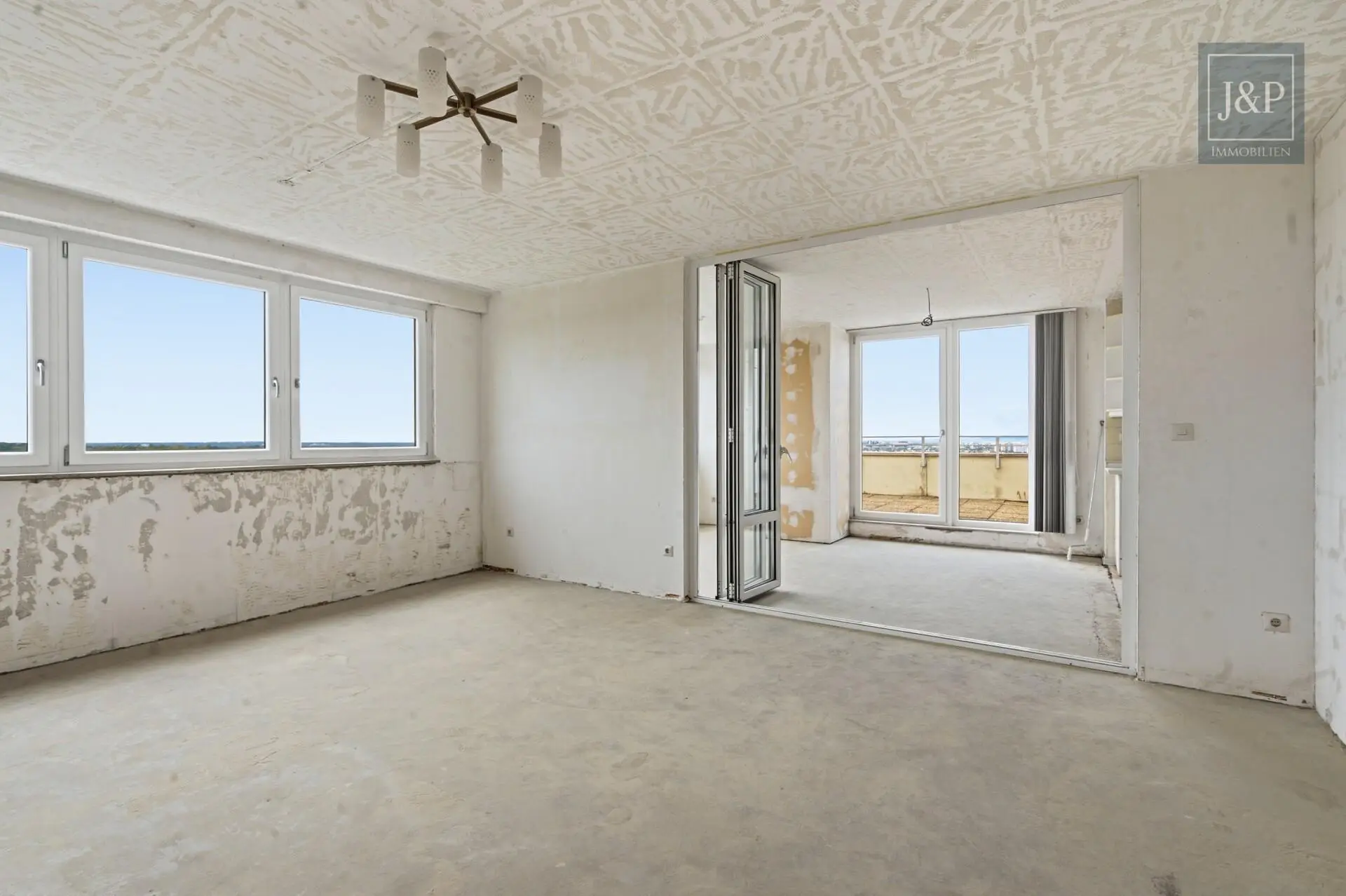 Beeindruckende Penthouse-Wohnung mit Skylineblick und zwei Terrassen! - Wohnzimmer